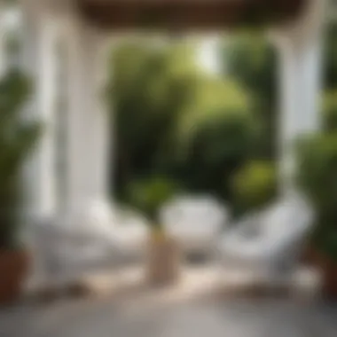 Inviting Spaces: The Allure of Outdoor Comfort A cozy outdoor nook with white woven chairs surrounded by greenery