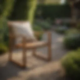 Elegant acacia wood patio chair in a lush garden setting