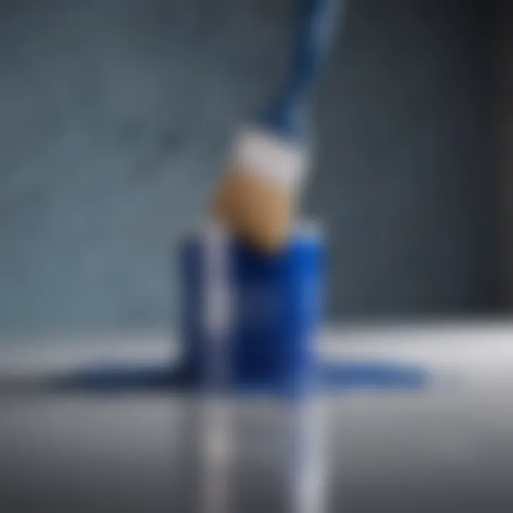 A close-up of a blue paint can with a brush, symbolizing office renovation.