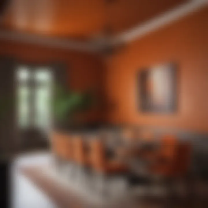 Dining area showcasing burnt orange walls and elegant furnishings