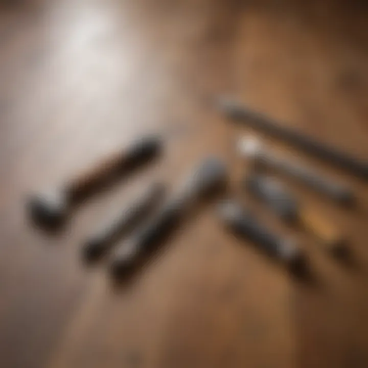 Various tools laid out on a wooden surface for refinishing wood floors