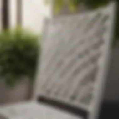 Close-up of the intricate weaving pattern on a white outdoor chair